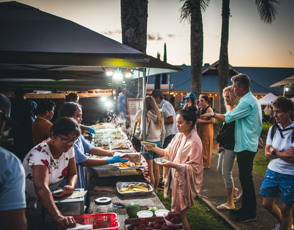 woman shopping merchandise at pop up tent