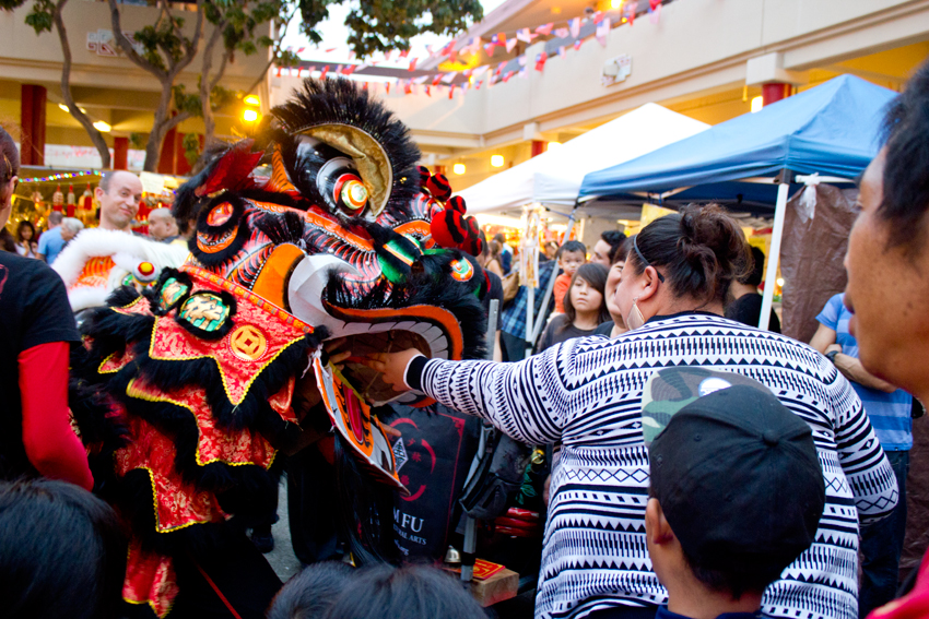 chinese new year lion feeding